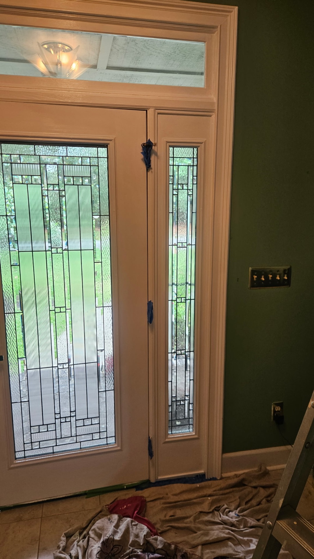 Door and casing masked off during finish paint